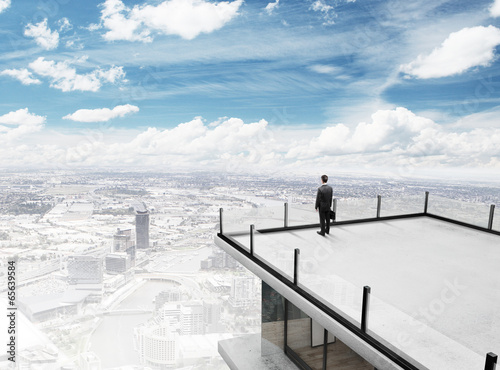 Photo: businessman on roof businessman on roof