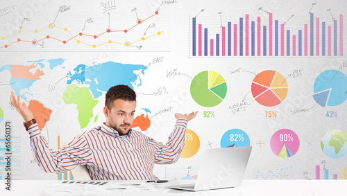 Photo: Business man with colorful charts Business man with colorful charts