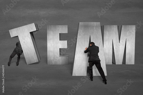Photo: Putting TEAM concrete word together Putting TEAM concrete word together