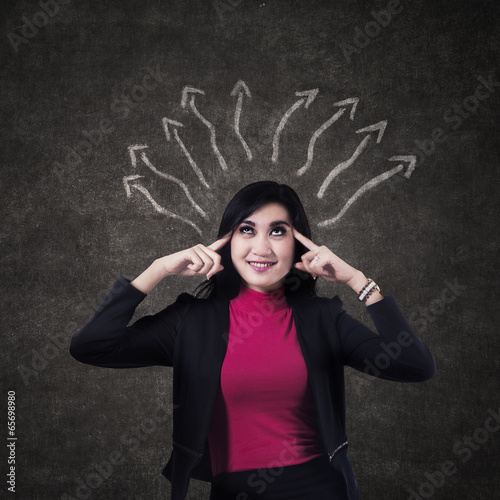 Photo: Businesswoman thinking a solution Businesswoman thinking a solution