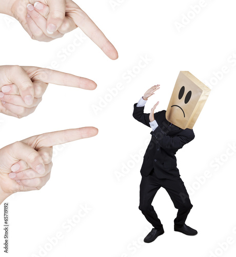 Photo: Sad businessman having scolded Sad businessman having scolded
