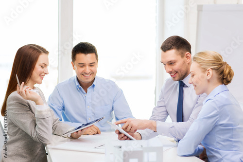 Photo: happy team of architects and designers in office happy team of architects and designers in office