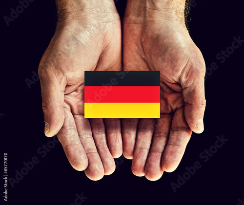 Photo: germany flag in hands germany flag in hands