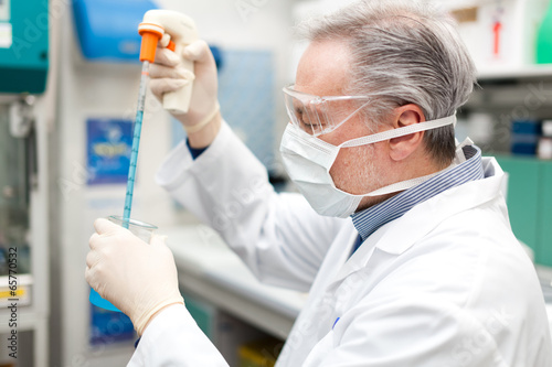 Photo: Scientist working in a laboratory Scientist working in a laboratory