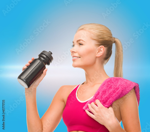 Photo: sporty woman with special sportsman bottle sporty woman with special sportsman bottle