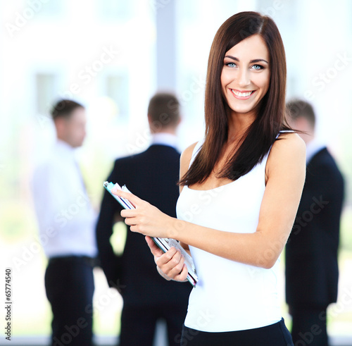 Photo: business woman with her staff business woman with her staff