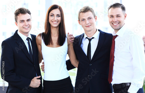 Photo: Closeup portrait of a successful business team laughing together Closeup portrait of a successful business team laughing together