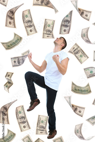 Photo: Happy man enjoying rain of money, isolated on white Happy man enjoying rain of money, isolated on white