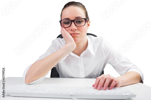 Photo: Businesswoman typing on a keyboard Businesswoman typing on a keyboard