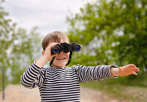 Photo: Young Boy Looking Through Binoculars Young Boy Looking Through Binoculars