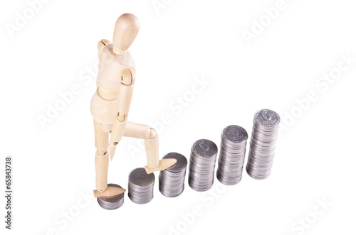 Photo: wooden man goes on coins wooden man goes on coins