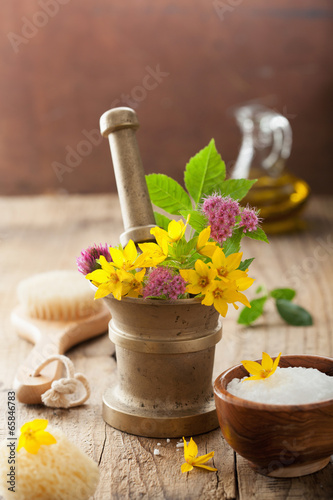 Photo: mortar with flowers and herbs for spa and aromatherapy mortar with flowers and herbs for spa and aromatherapy