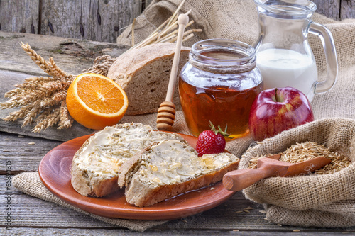 Photo: Healthy breakfast with honey, fruit and wholemeal bread Healthy breakfast with honey, fruit and wholemeal bread