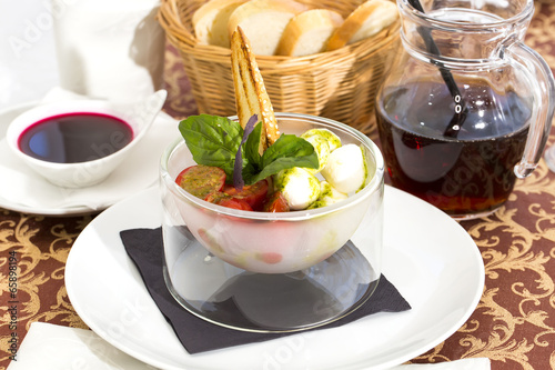Photo: tomatoes and cheese in a glass bowl tomatoes and cheese in a glass bowl