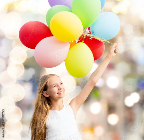 Photo: happy girl with colorful balloons happy girl with colorful balloons