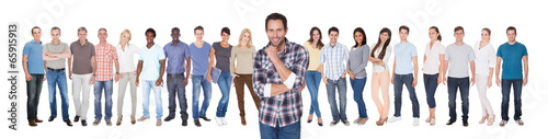 Photo: Confident Man With Friends Against White Background Confident Man With Friends Against White Background