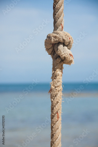 Photo: knot on the rope and sea knot on the rope and sea