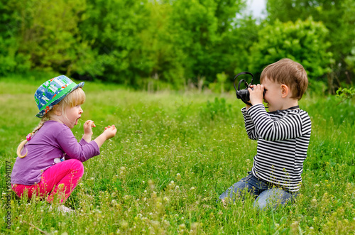 Photo: Young boy and girl playing with binoculars Young boy and girl playing with binoculars