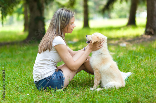 Photo: Woman at the park with a dog Woman at the park with a dog