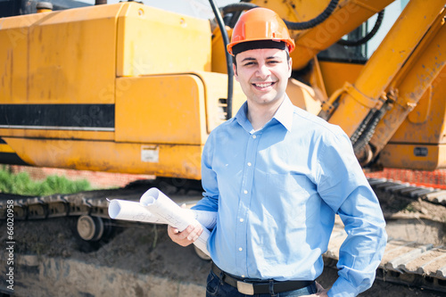 Photo: Architect in a construction site Architect in a construction site