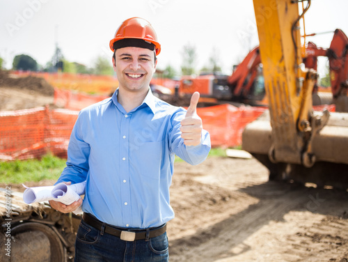 Photo: Architect in a construction site Architect in a construction site