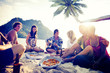 Group of Cheerful Young People Relaxing on a Beach Group of Cheerful Young People Relaxing on a Beach