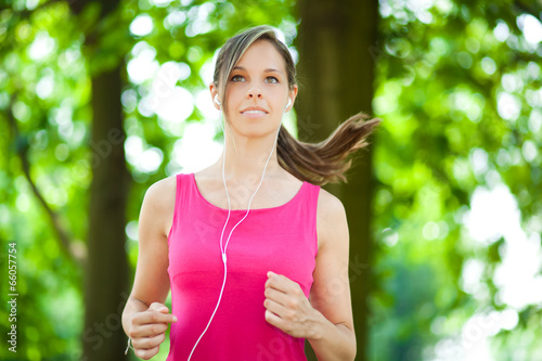 Photo: Woman running in a park Woman running in a park