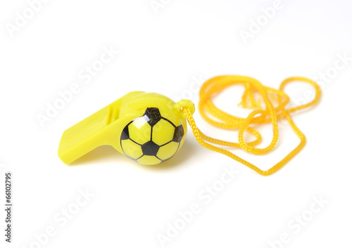 Photo: football shape whistle isolated on a white background. football shape whistle isolated on a white background.