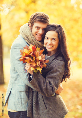 Photo: romantic couple in the autumn park romantic couple in the autumn park