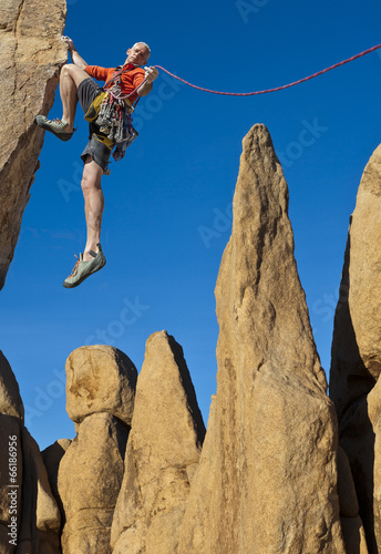 Photo: Climber on the edge. Climber on the edge.
