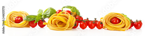 Fototapeta Raw homemade pasta and tomatoes, isolated on white