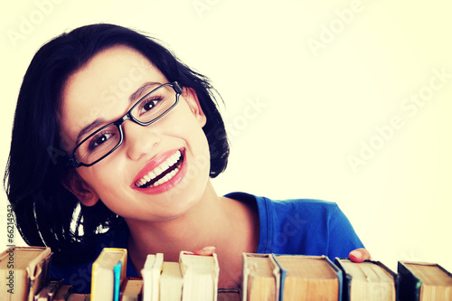 Photo: Happy smiling young student woman with books Happy smiling young student woman with books