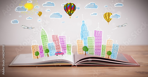 Photo: cityscape drawing on open book cityscape drawing on open book