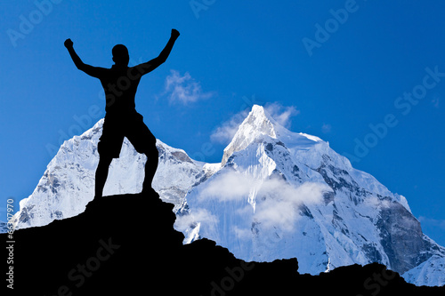 Photo: Man hiking success silhouette in mountains Man hiking success silhouette in mountains