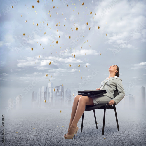 Photo: Young business woman looking up Young business woman looking up