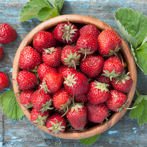 Photo: strawberries in wooden bowl strawberries in wooden bowl
