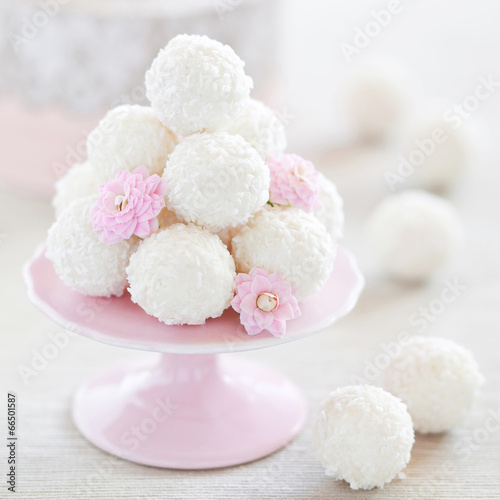 Photo: Coconut white chocolate truffles, selective focus Coconut white chocolate truffles, selective focus