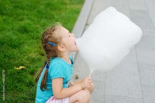 Photo: girl eating cotton candy girl eating cotton candy