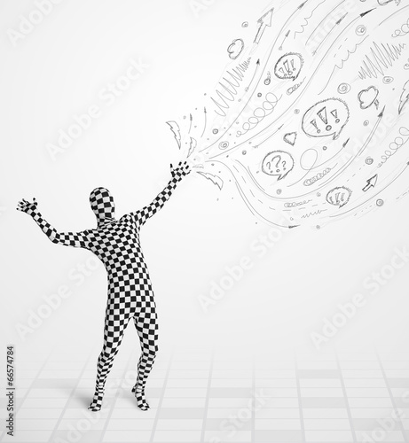 Photo: Guy in body suit morphsuit looking at sketches and doodles Guy in body suit morphsuit looking at sketches and doodles