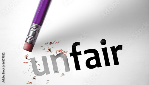 Photo: Eraser changing the word unfair for fair Eraser changing the word unfair for fair