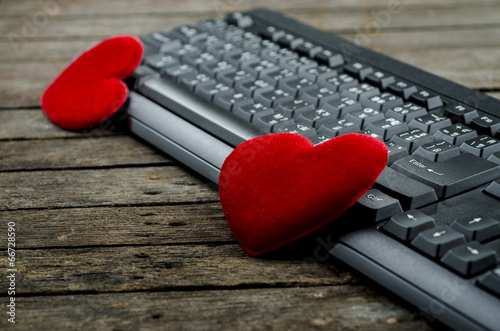 Photo: Red heart and Computer Keyboard on wooden Red heart and Computer Keyboard on wooden