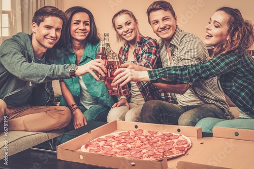Photo: Group of young multi-ethnic friends having party Group of young multi-ethnic friends having party