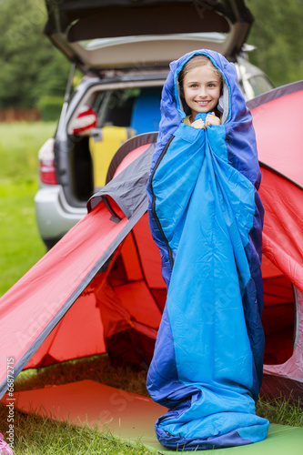 Photo: Camp in the tent - young girl on the camping Camp in the tent - young girl on the camping