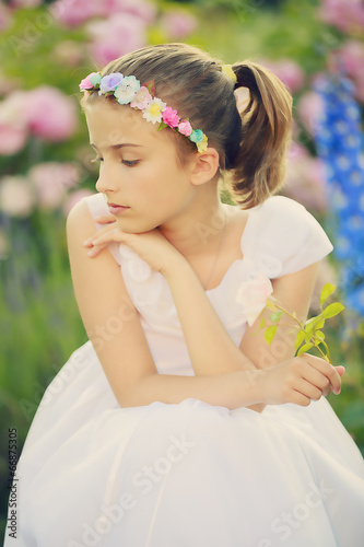 Photo: Summer garden - beautiful girl in the flower garden Summer garden - beautiful girl in the flower garden