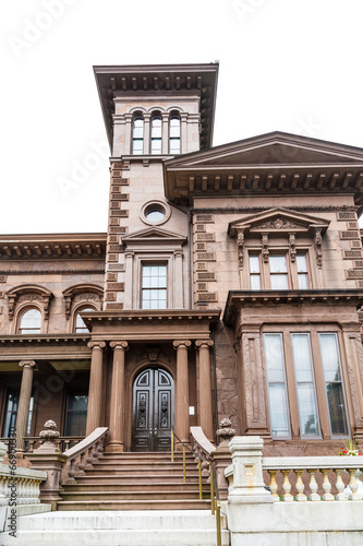 Photo: Old Brown Stone House Isolated on White Old Brown Stone House Isolated on White
