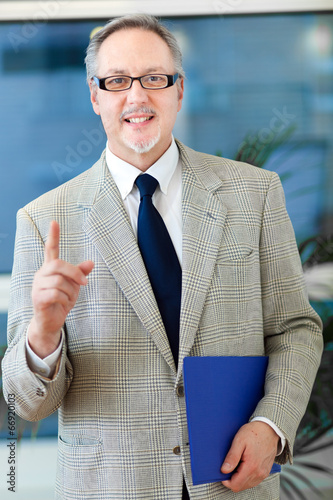 Photo: Smiling mature businessman Smiling mature businessman
