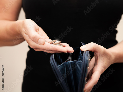Photo: woman with coins and purse woman with coins and purse