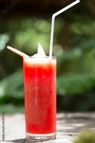 Photo: Smoothie water melon on green background Smoothie water melon on green background