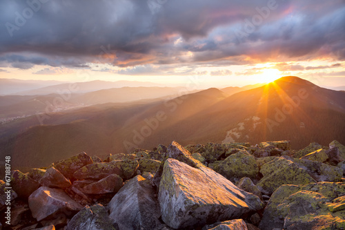  Majestic sunset in the mountains landscape. Dramatic sky and col