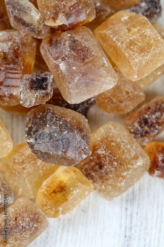 Photo: caramelized sugar on wooden surface caramelized sugar on wooden surface